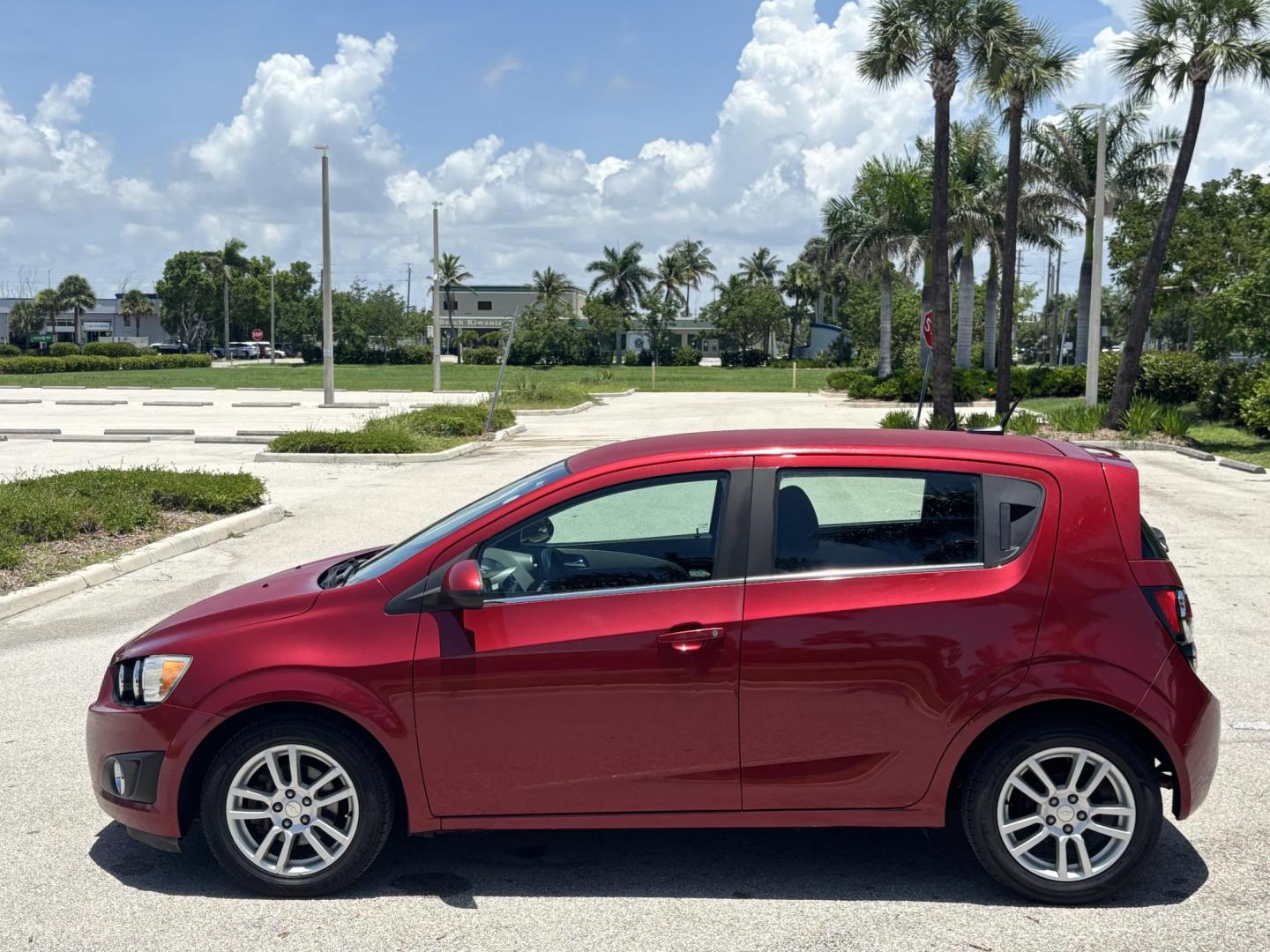 2013 RED Chevrolet Sonic LT Auto 5-Door (1G1JC6SH1D4) with an 1.8L L4 DOHC 24V FFV engine, 6-Speed Automatic transmission, located at 11170 Summerlin Square Dr., Fort Myers Beach, FL, 33931, (239) 999-7777, 26.493546, -81.941628 - Photo#5