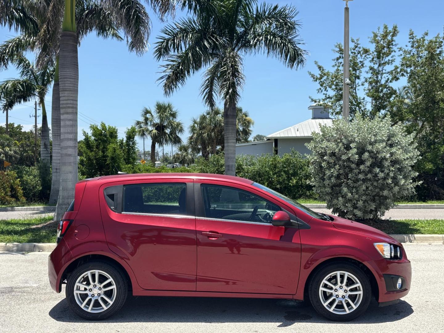 2013 RED Chevrolet Sonic LT Auto 5-Door (1G1JC6SH1D4) with an 1.8L L4 DOHC 24V FFV engine, 6-Speed Automatic transmission, located at 11170 Summerlin Square Dr., Fort Myers Beach, FL, 33931, (239) 999-7777, 26.493546, -81.941628 - Photo#3