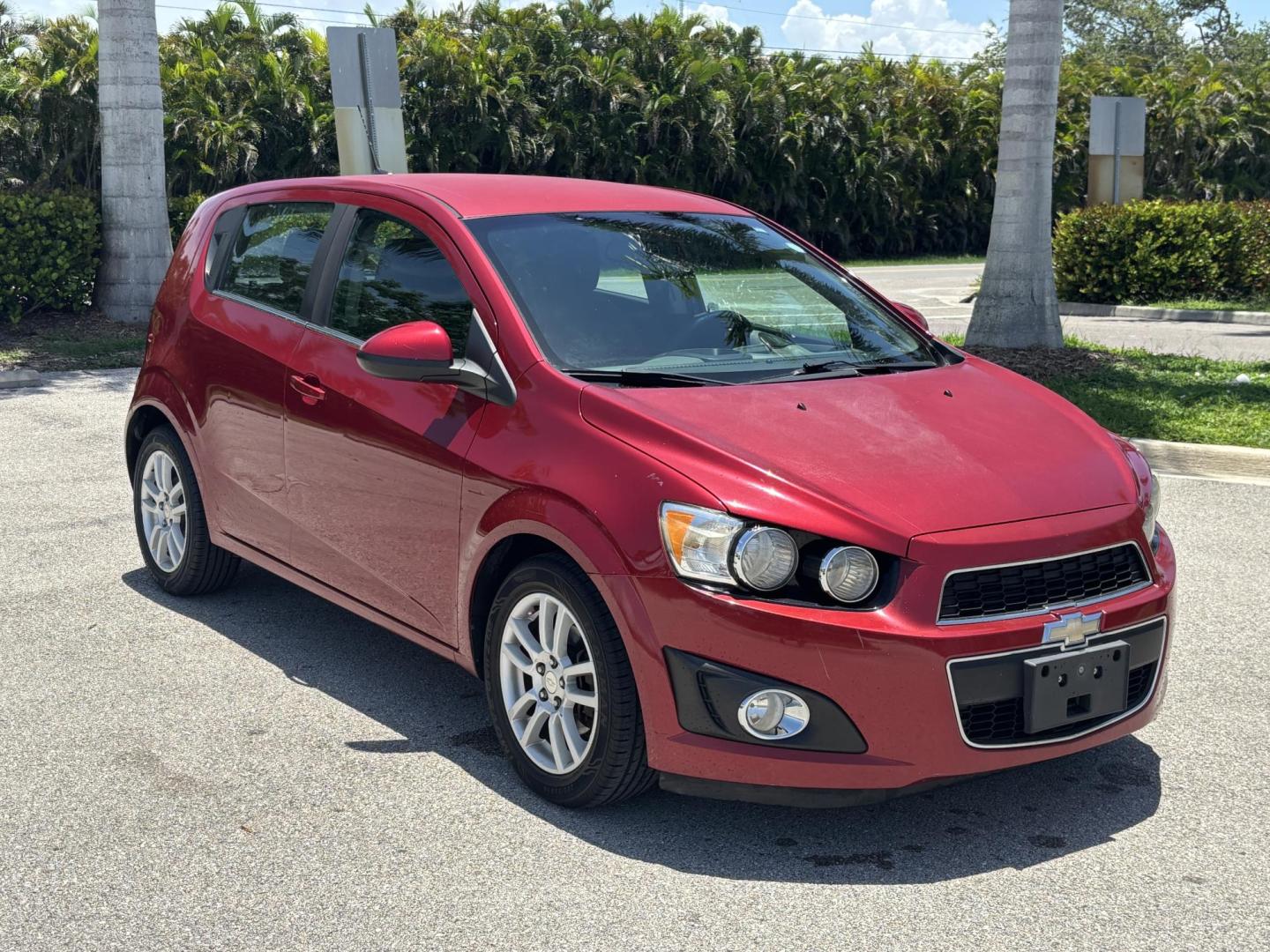 2013 RED Chevrolet Sonic LT Auto 5-Door (1G1JC6SH1D4) with an 1.8L L4 DOHC 24V FFV engine, 6-Speed Automatic transmission, located at 11170 Summerlin Square Dr., Fort Myers Beach, FL, 33931, (239) 999-7777, 26.493546, -81.941628 - Photo#2
