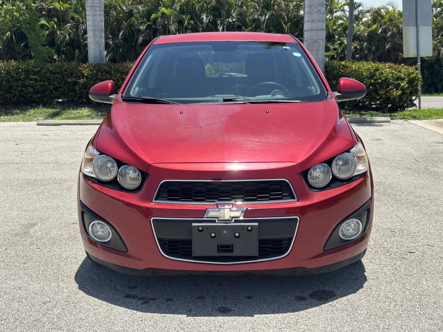 2013 RED Chevrolet Sonic LT Auto 5-Door (1G1JC6SH1D4) with an 1.8L L4 DOHC 24V FFV engine, 6-Speed Automatic transmission, located at 11170 Summerlin Square Dr., Fort Myers Beach, FL, 33931, (239) 999-7777, 26.493546, -81.941628 - Photo#1