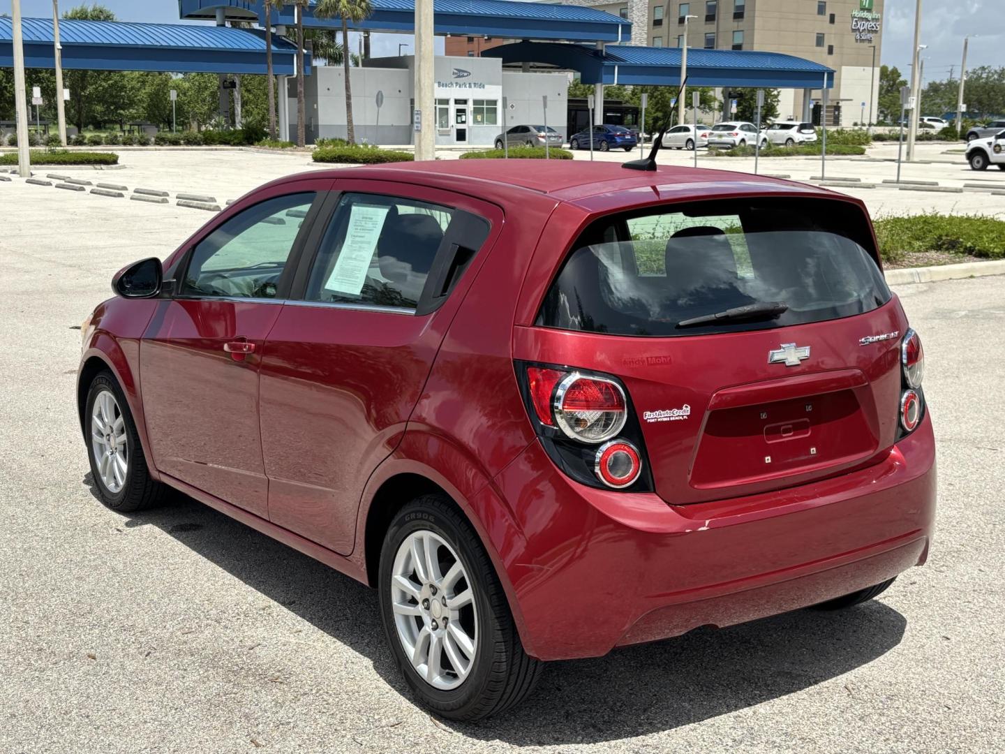 2013 RED /DARK GRAY Chevrolet Sonic LT Auto 5-Door (1G1JC6SH1D4) with an 1.8L L4 DOHC 24V FFV engine, 6-Speed Automatic transmission, located at 11170 Summerlin Square Dr., Fort Myers Beach, FL, 33931, (239) 999-7777, 26.493546, -81.941628 - We have financing available and we accept trades! Fill out a credit application on our website or come by today! If you have any questions, give us a call at (239) 999 - 7777 or visit our website at firstautocredit.com. 11170 Summerlin Square Dr, Fort Myers Beach, FL 33931 Carfax 2 Owner M - Photo#4