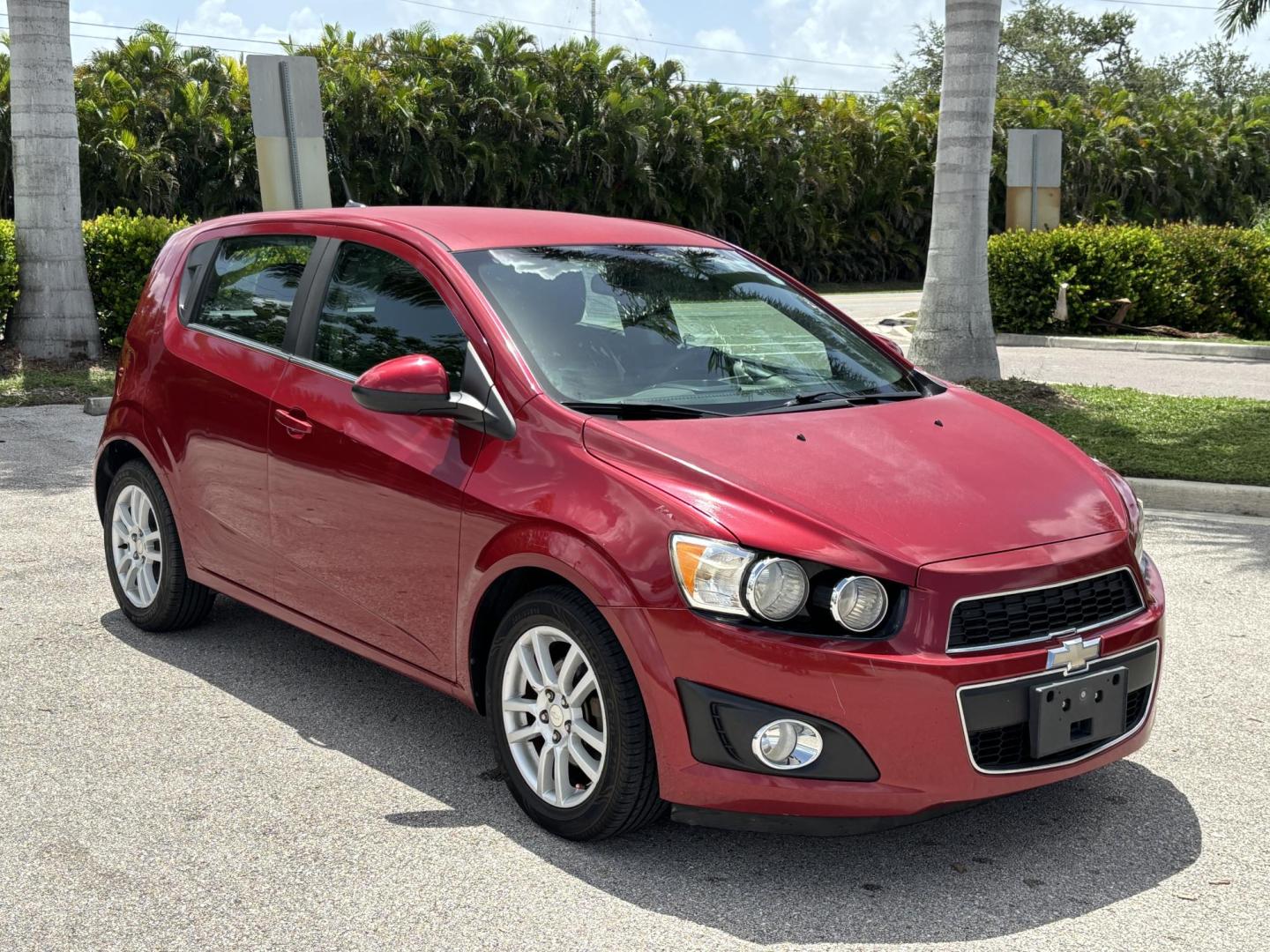 2013 RED /DARK GRAY Chevrolet Sonic LT Auto 5-Door (1G1JC6SH1D4) with an 1.8L L4 DOHC 24V FFV engine, 6-Speed Automatic transmission, located at 11170 Summerlin Square Dr., Fort Myers Beach, FL, 33931, (239) 999-7777, 26.493546, -81.941628 - We have financing available and we accept trades! Fill out a credit application on our website or come by today! If you have any questions, give us a call at (239) 999 - 7777 or visit our website at firstautocredit.com. 11170 Summerlin Square Dr, Fort Myers Beach, FL 33931 Carfax 2 Owner M - Photo#2