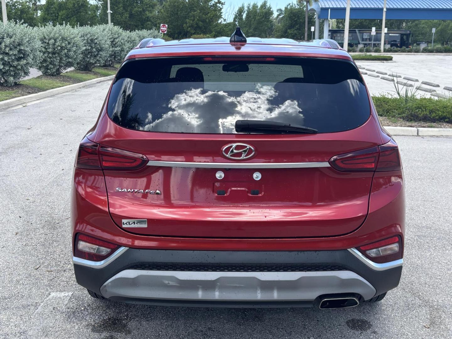 2019 RED Hyundai Santa Fe SE 2.4 (5NMS23AD9KH) with an 2.4L L4 DOHC 16V engine, 8A transmission, located at 11170 Summerlin Square Dr., Fort Myers Beach, FL, 33931, (239) 999-7777, 26.493546, -81.941628 - Photo#5