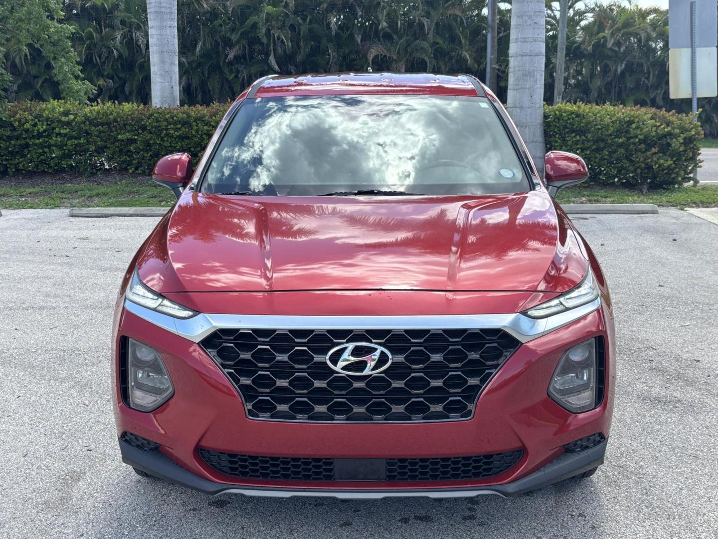 2019 RED Hyundai Santa Fe SE 2.4 (5NMS23AD9KH) with an 2.4L L4 DOHC 16V engine, 8A transmission, located at 11170 Summerlin Square Dr., Fort Myers Beach, FL, 33931, (239) 999-7777, 26.493546, -81.941628 - Photo#1